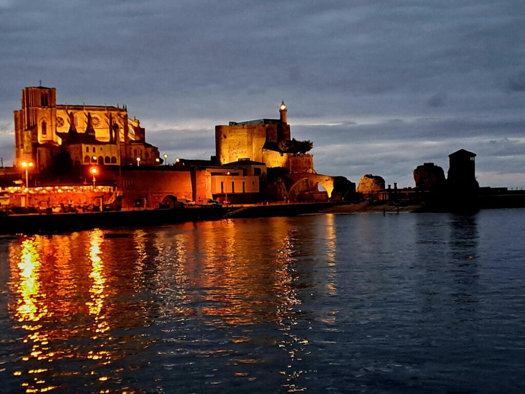 A large body of water with a castle in the background